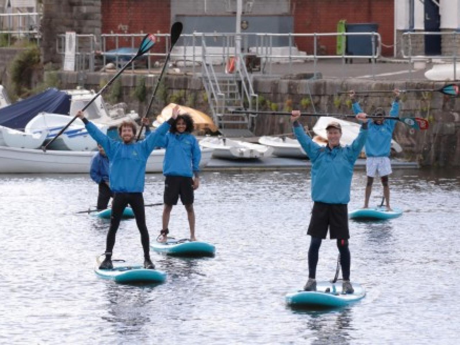 paddle boarding oars in air