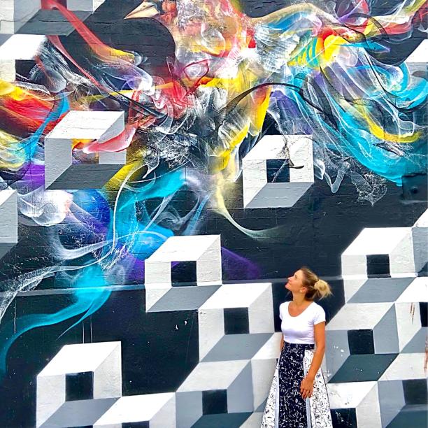 Student Roxana with colourful graffiti